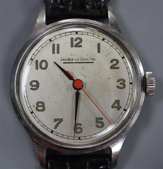 A gentlemans stainless steel Jaeger LeCoultre manual wind wrist watch, on later associated strap.